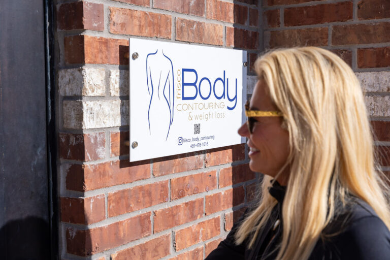 A woman is walking into the Frisco Body Contouring building for laser pigmentation treatment